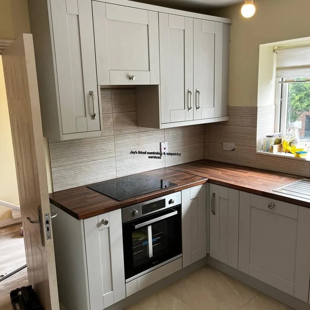 Cream shaker kitchen with a wood worktop
