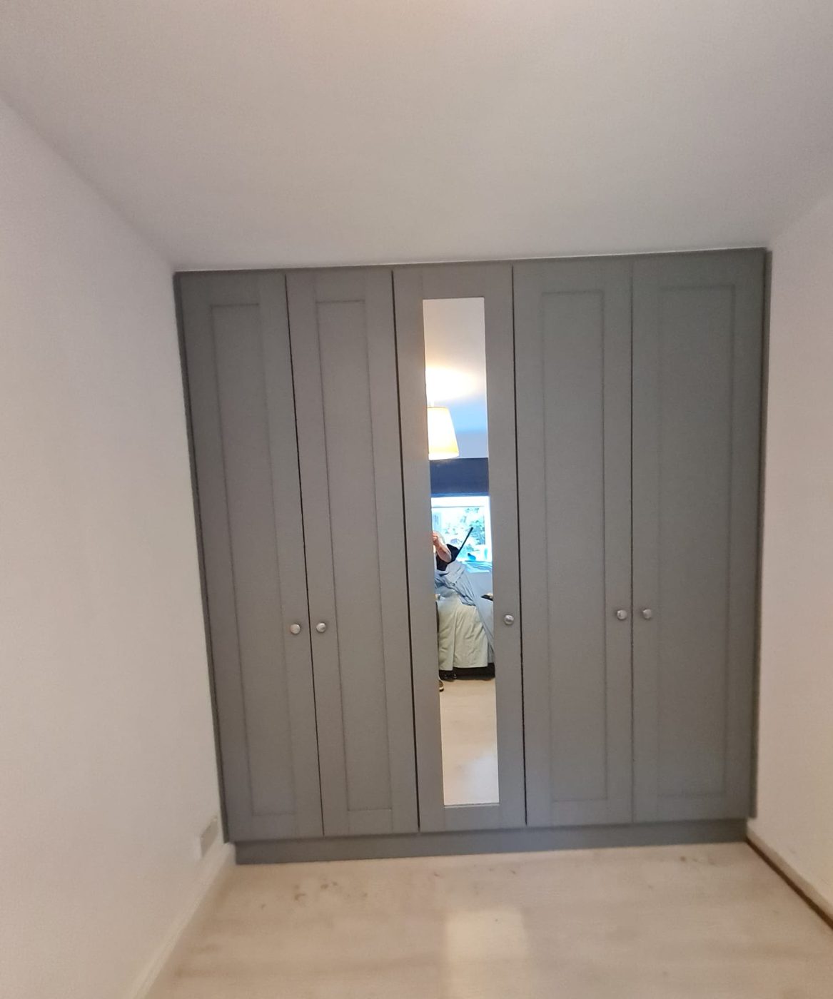 Grey shaker doors with a mirror panel
