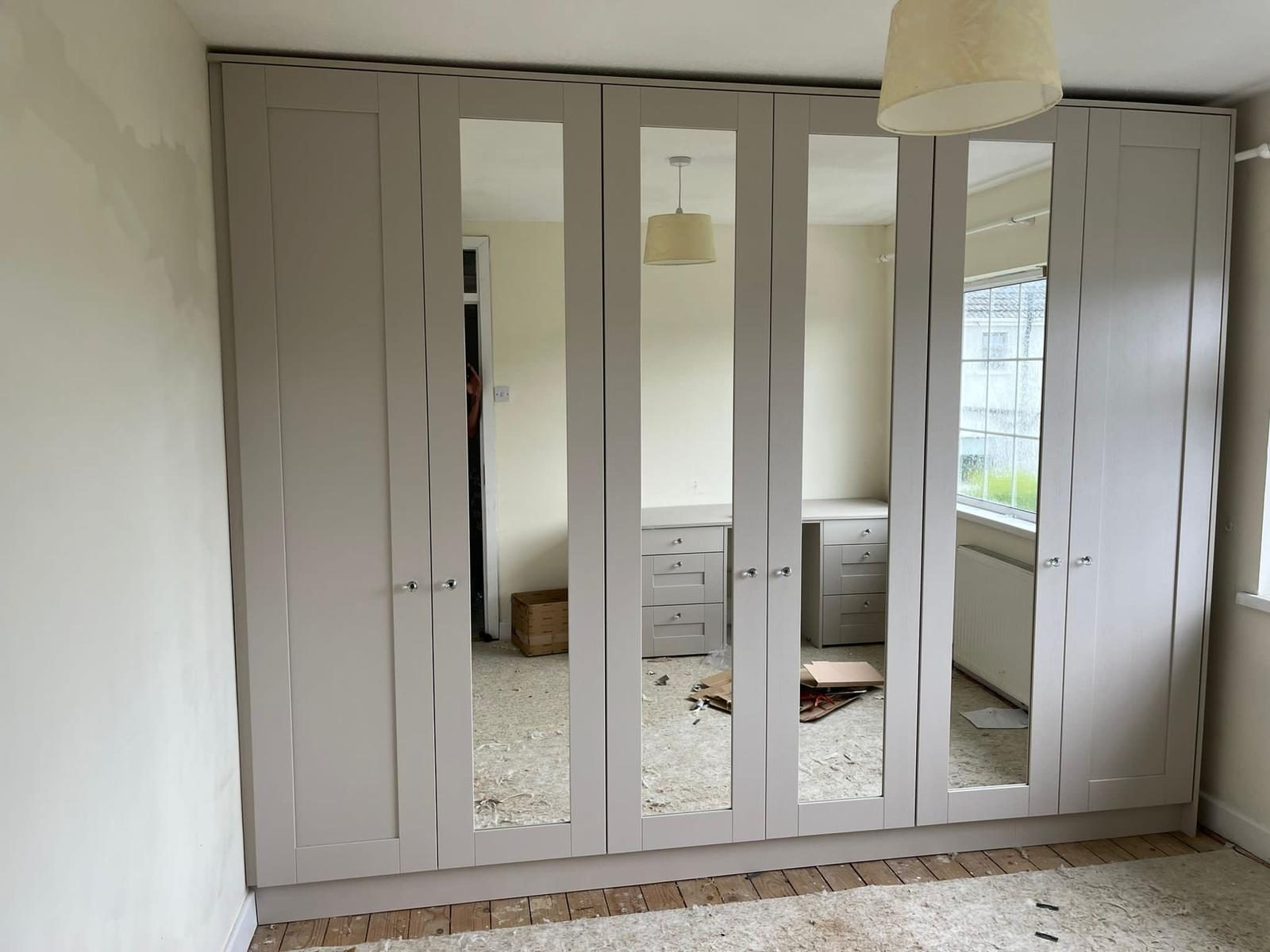 Finished grey shaker wardrobes with mirror doors