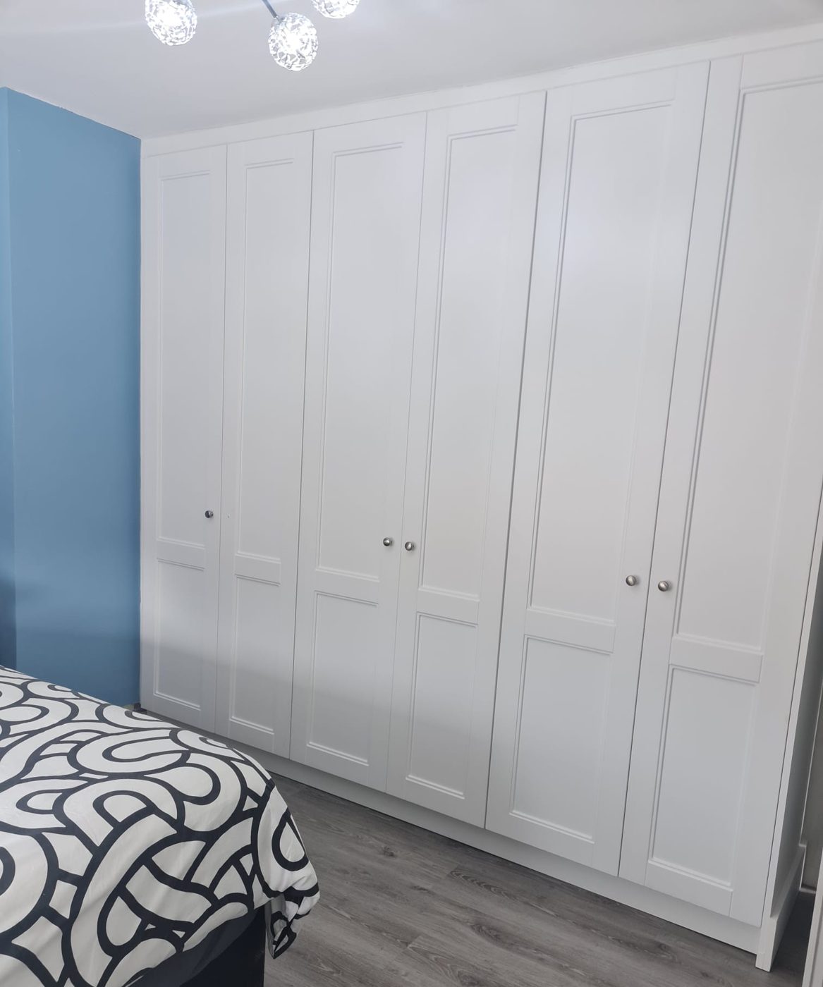 Five white shaker doors, wall to wall