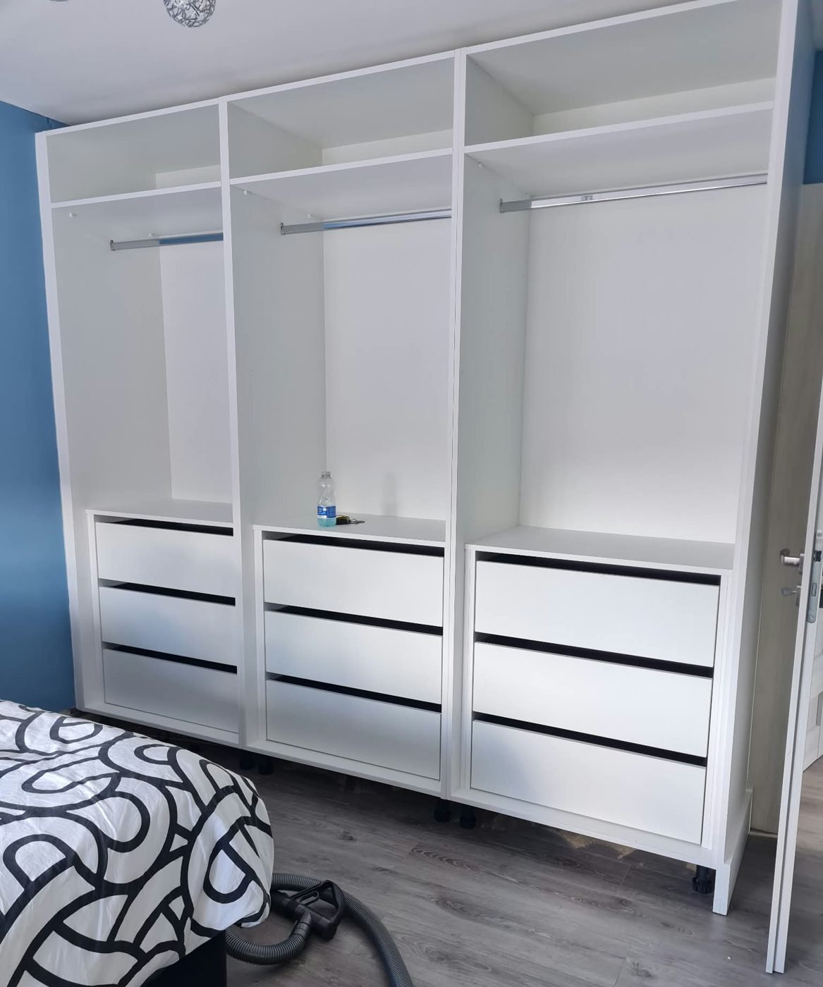 White interior with rails over three banks of drawers